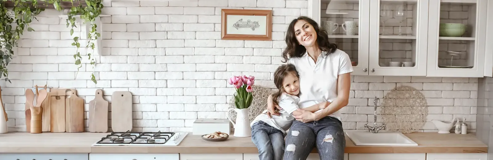 mother and daughter hanging out in kitchen